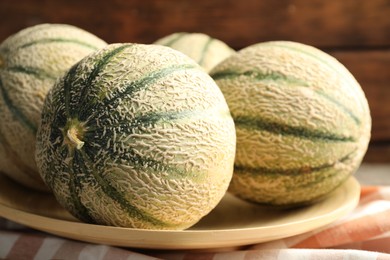 Photo of Tasty ripe Cantaloupe melons on table, closeup