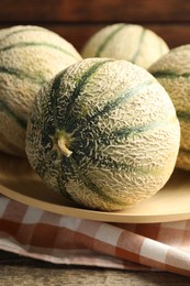 Photo of Tasty ripe Cantaloupe melons on table, closeup