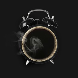 Image of Alarm clock with coffee instead of dial on black background, top view