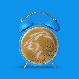 Image of Bright alarm clock with coffee instead of dial on light blue background