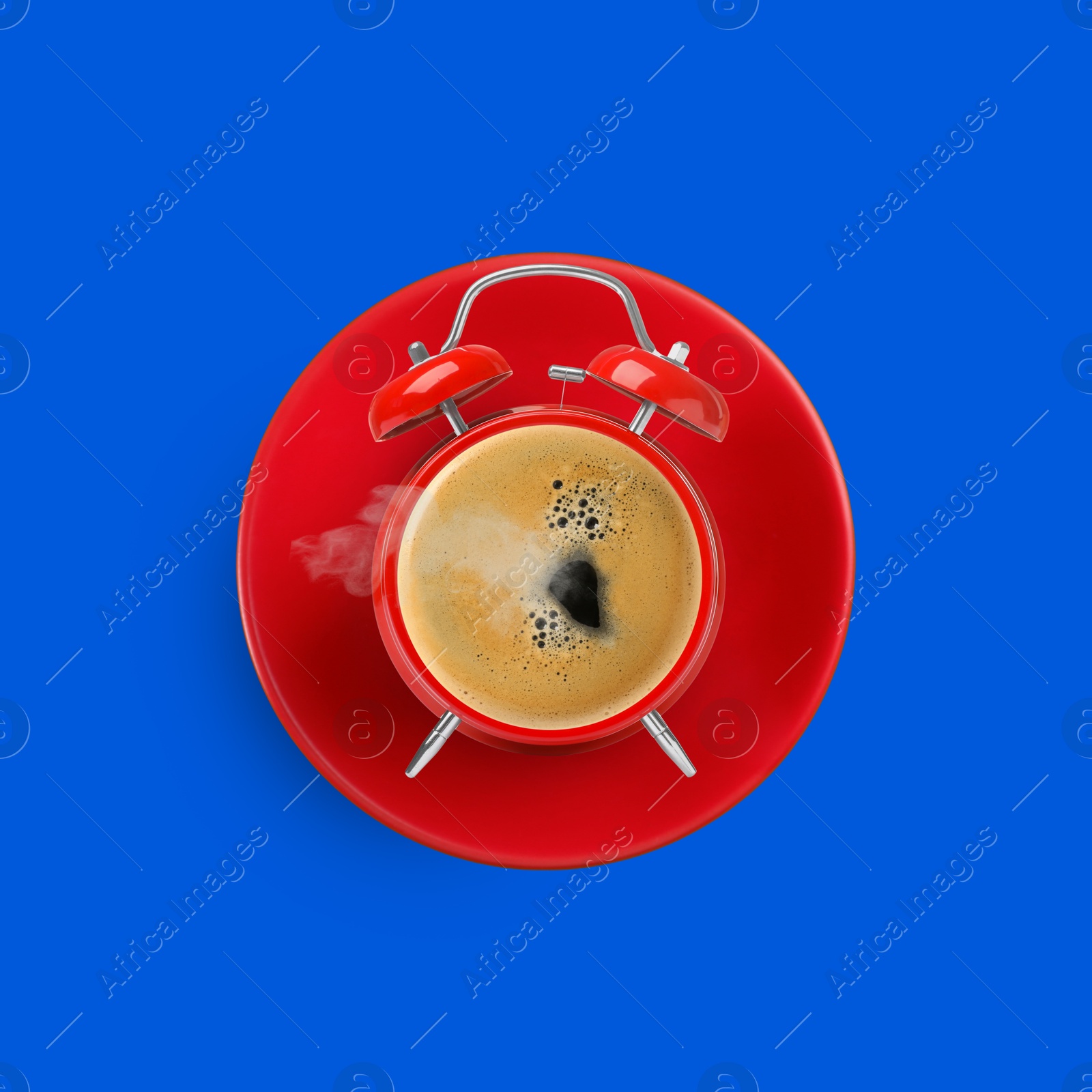 Image of Red alarm clock with coffee instead of dial on blue background, top view