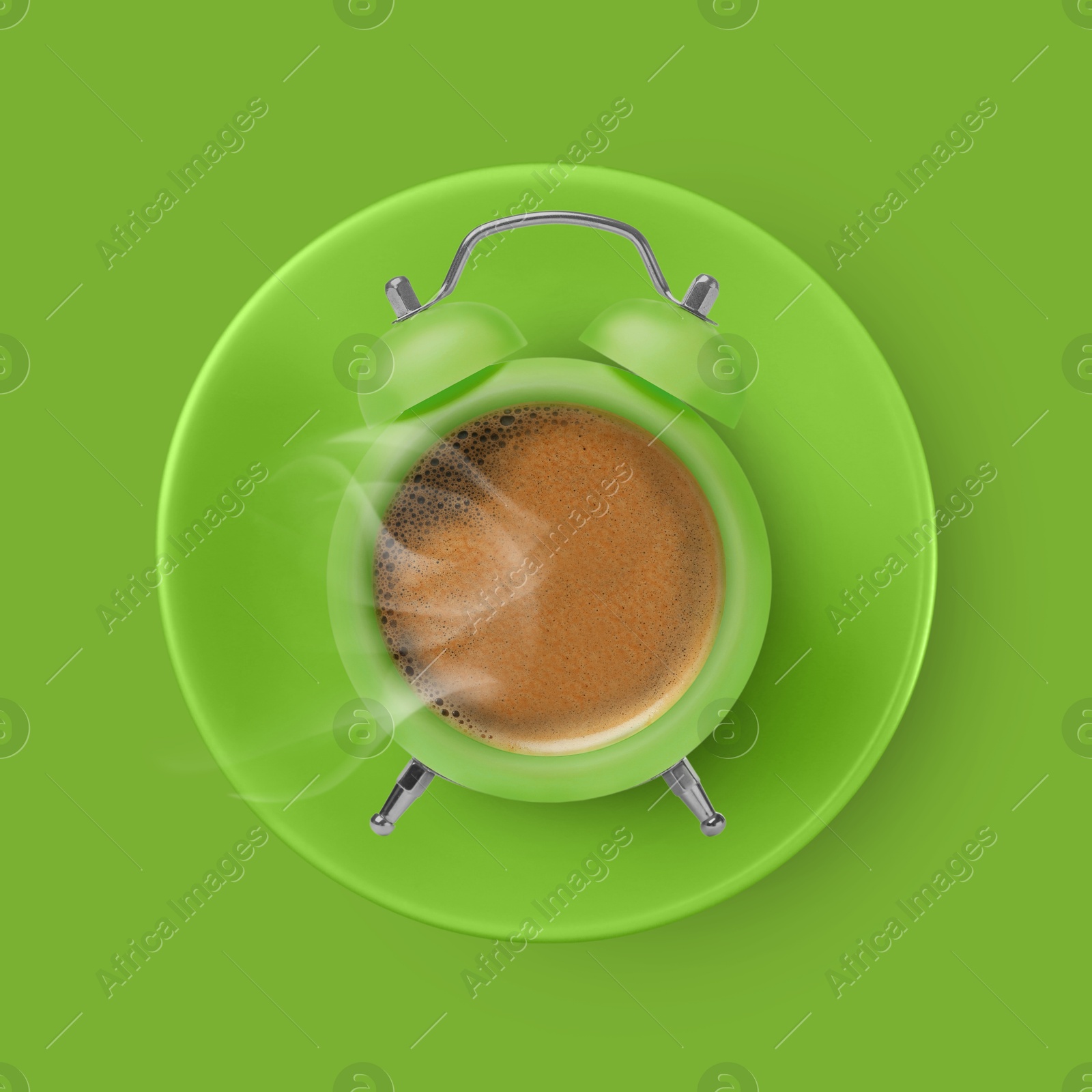 Image of Bright alarm clock with coffee instead of dial on green background, top view