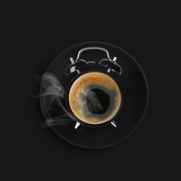 Image of Alarm clock with coffee instead of dial on black background, top view