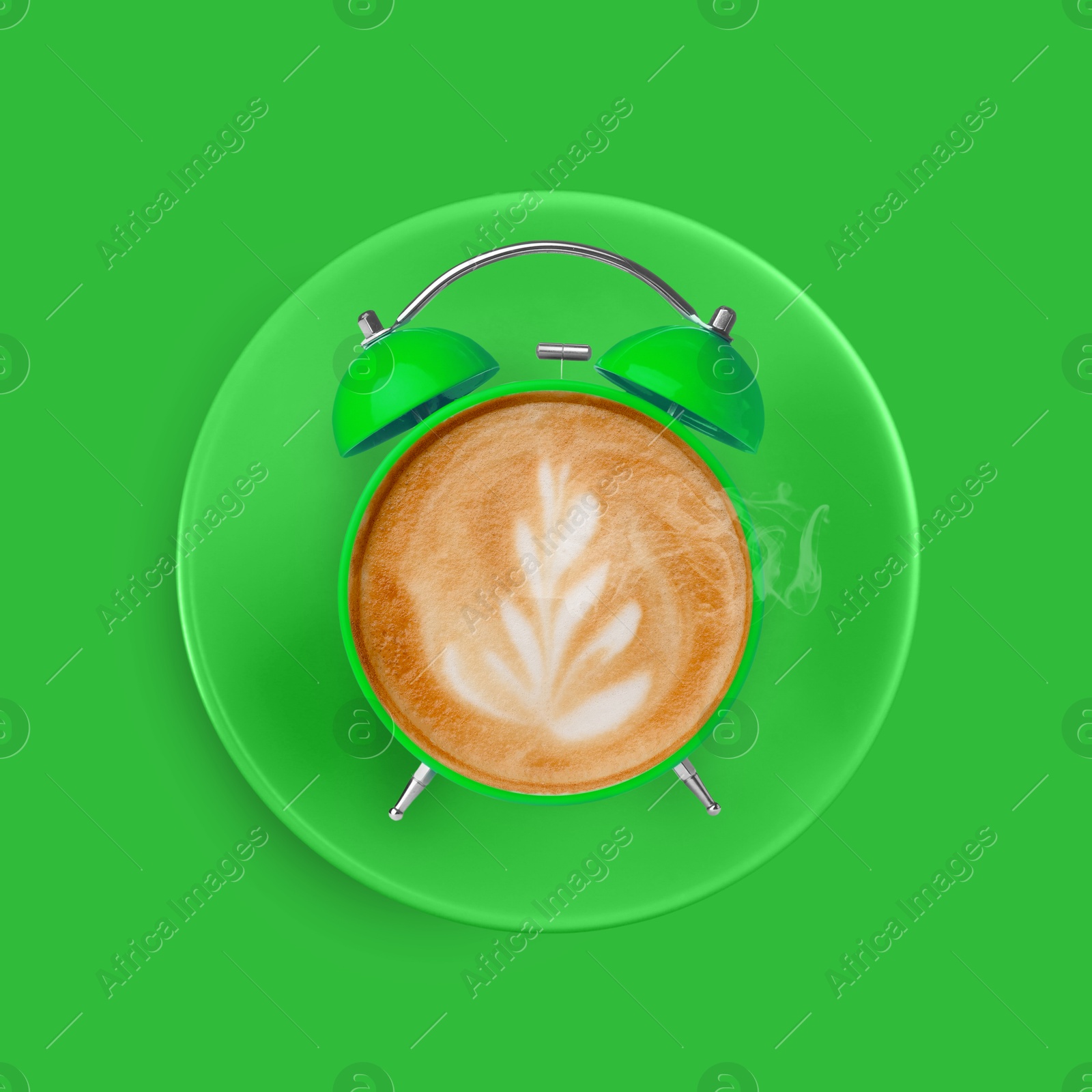 Image of Bright alarm clock with coffee instead of dial on green background, top view