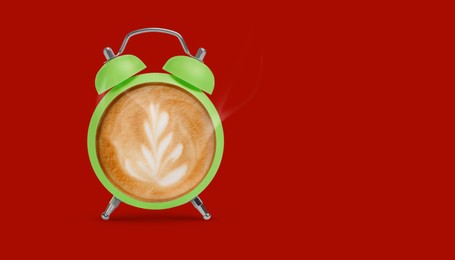 Image of Green alarm clock with coffee instead of dial on red background, banner design. Space for text