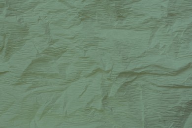 Image of Crumpled sage paper as background, closeup view