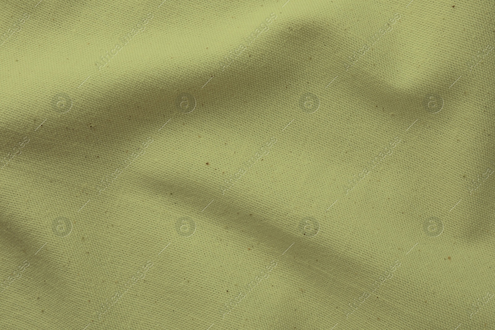 Image of Crumpled sage color fabric as background, closeup