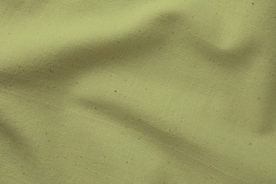 Image of Crumpled sage color fabric as background, closeup