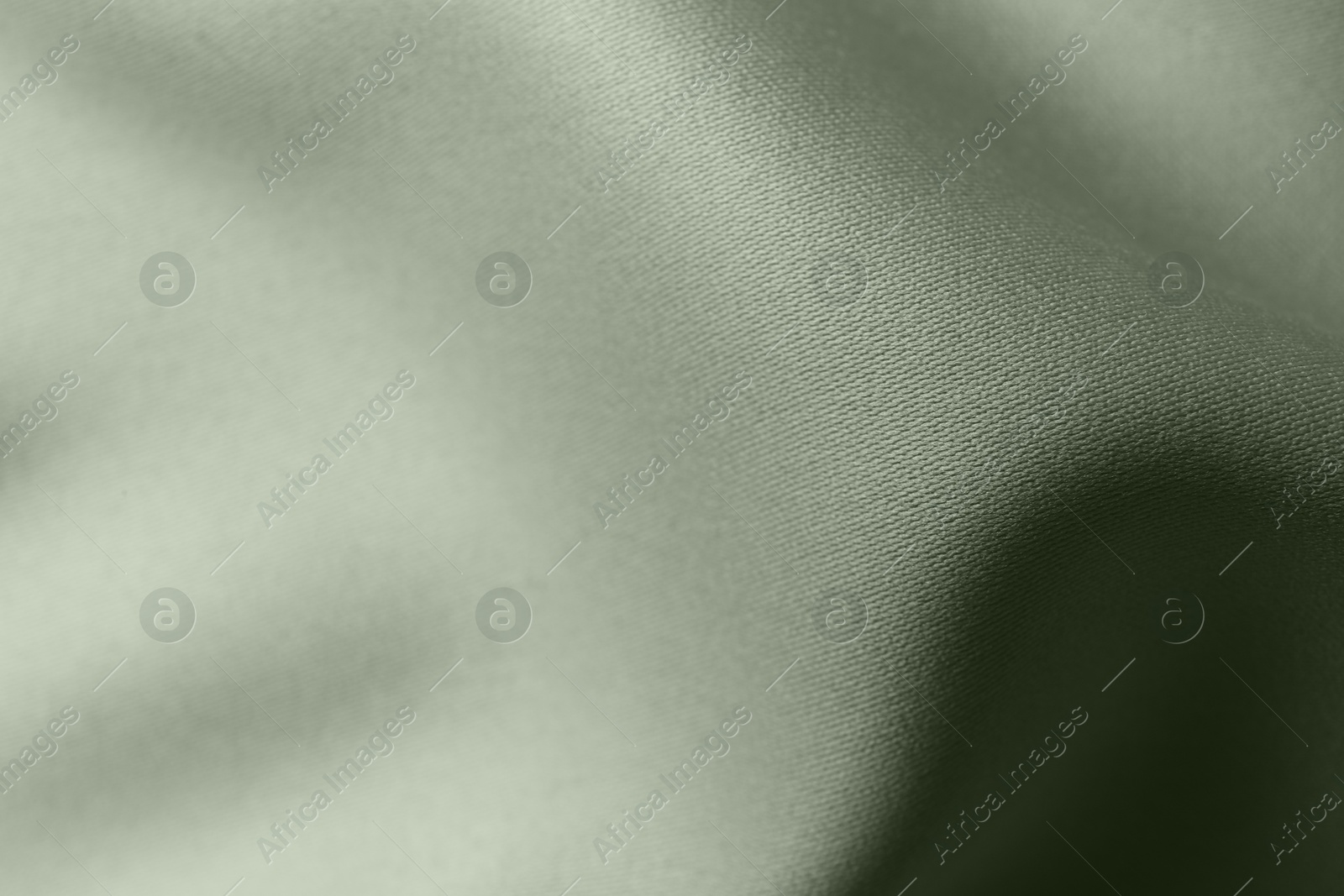 Image of Sage color silk fabric as background, closeup