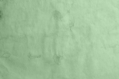 Image of Old sage color paper as background, closeup of texture