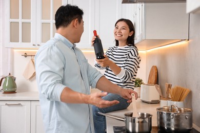 Photo of Happy lovely couple cooking together in kitchen