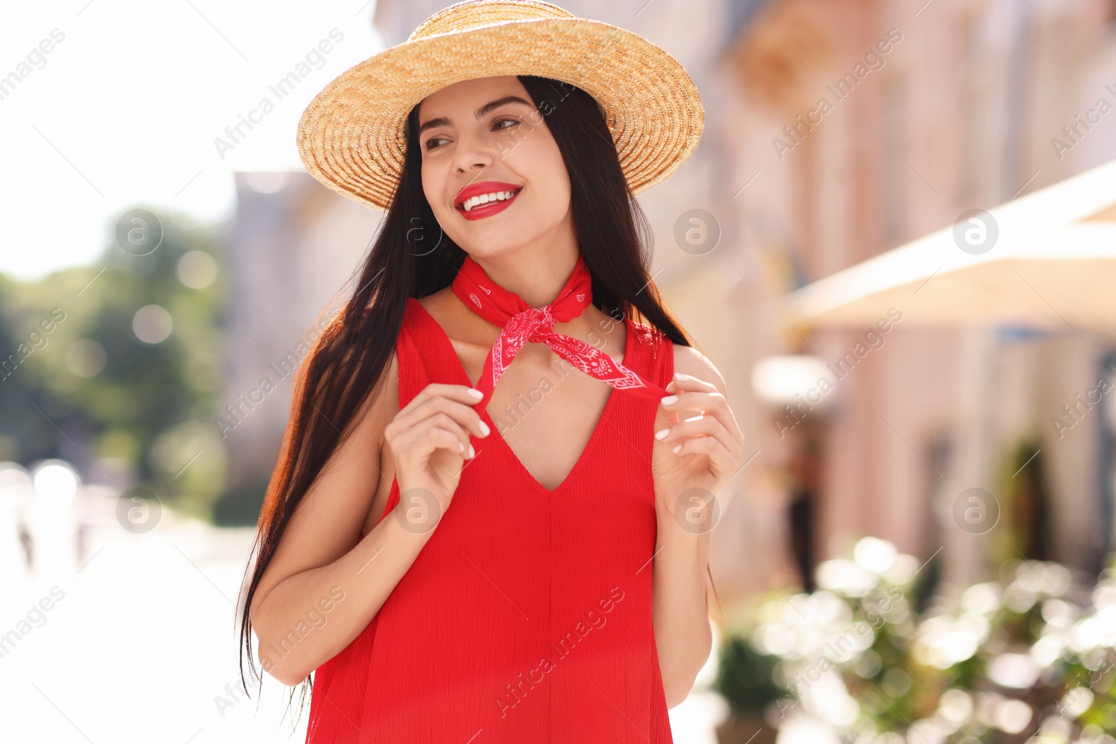 Photo of Beautiful young woman in stylish hat on city street