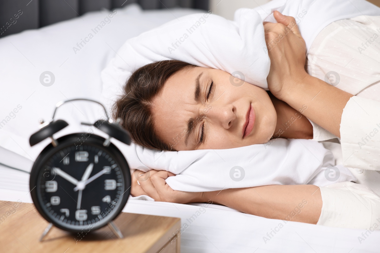 Photo of Sleepy woman in bed at lunch time