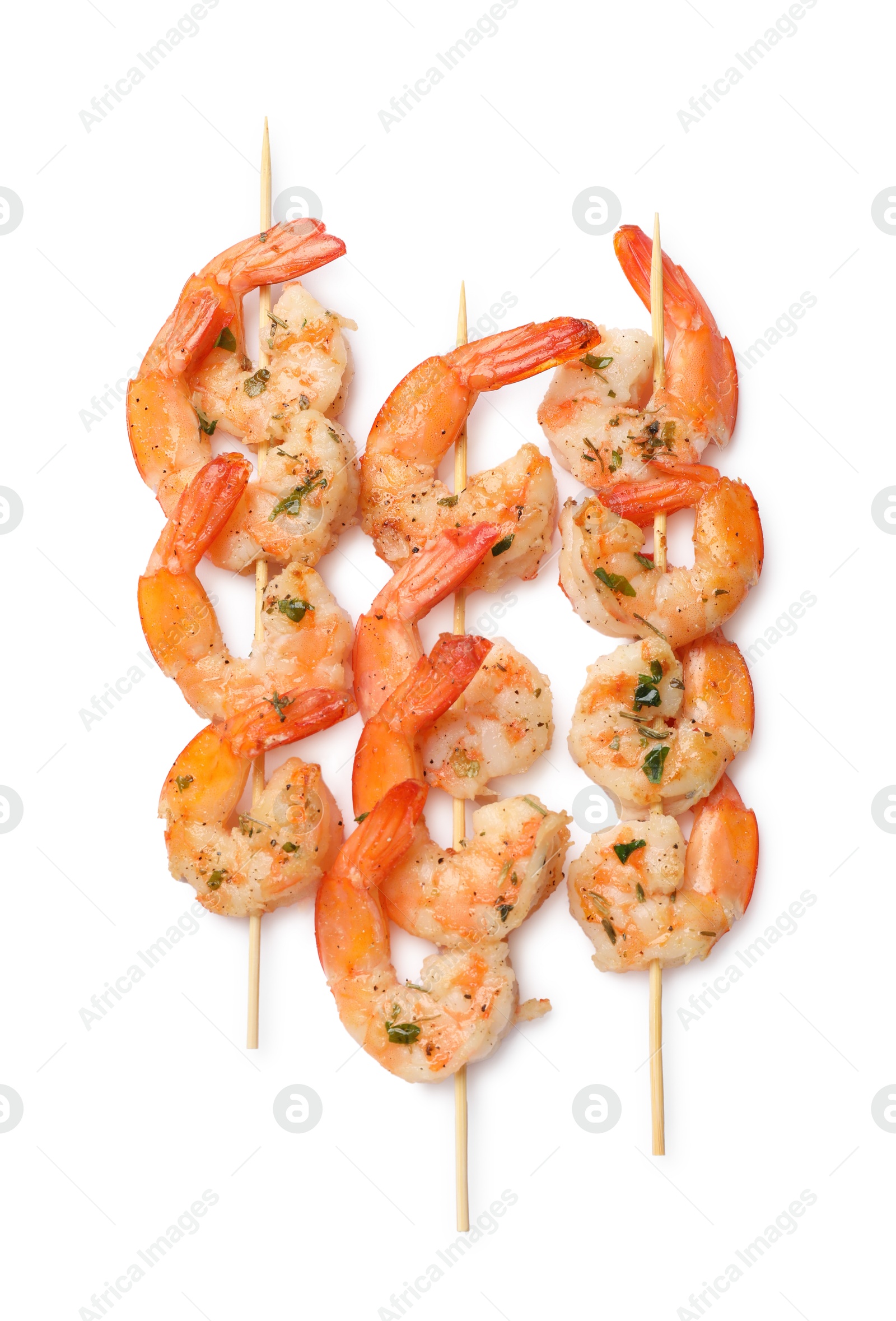 Photo of Skewers with delicious grilled shrimps isolated on white, top view