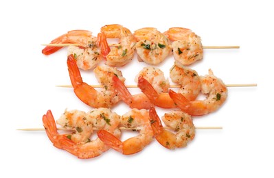 Photo of Skewers with delicious grilled shrimps isolated on white, top view