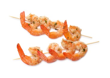 Photo of Skewers with delicious grilled shrimps isolated on white, top view