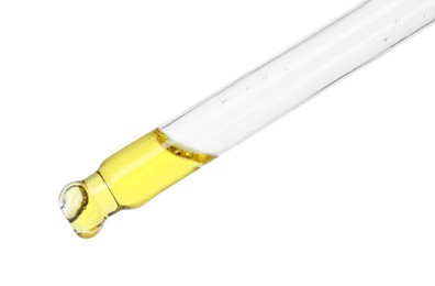 Photo of Dripping essential oil from pipette on white background