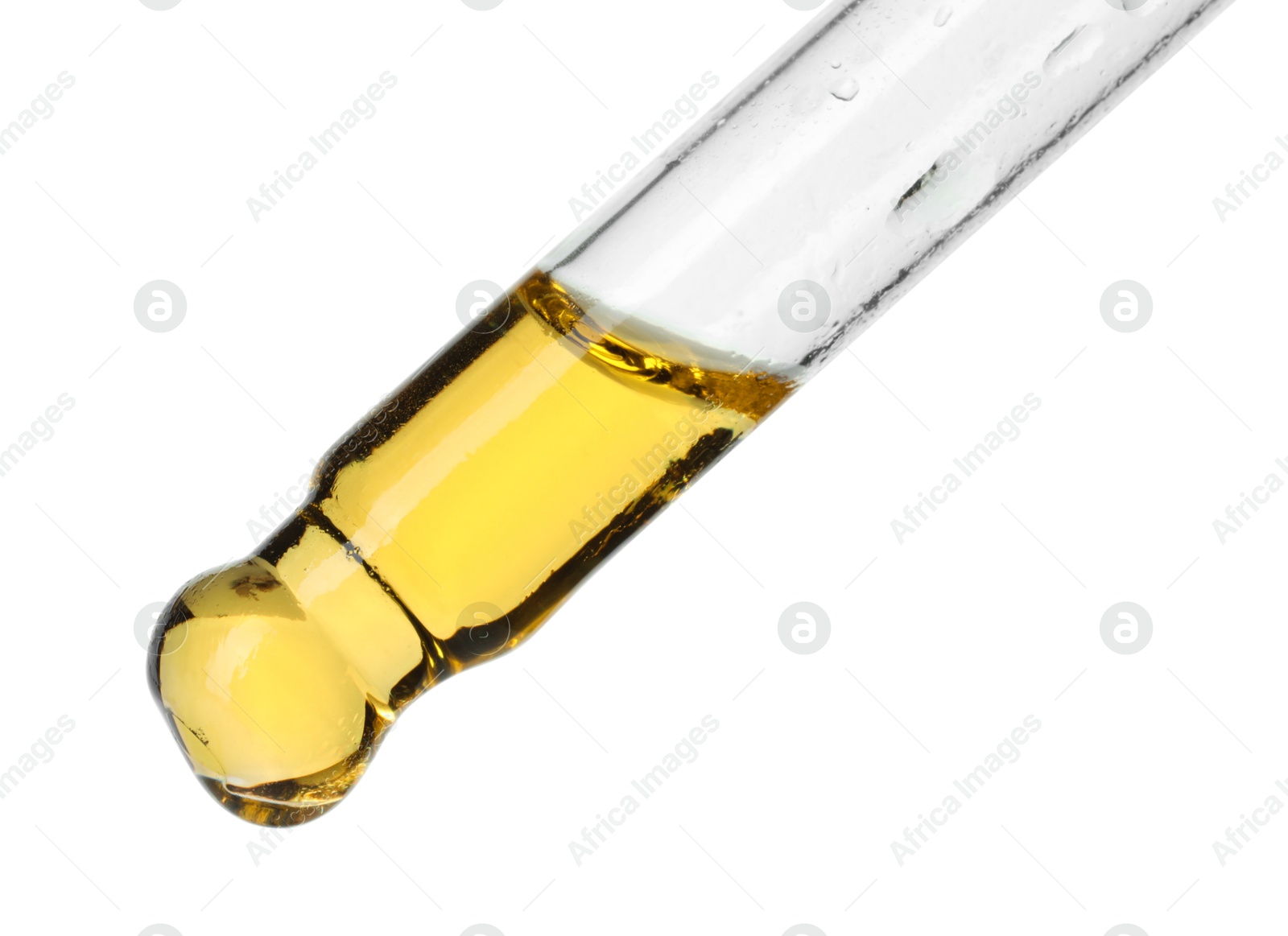 Photo of Dripping essential oil from pipette on white background