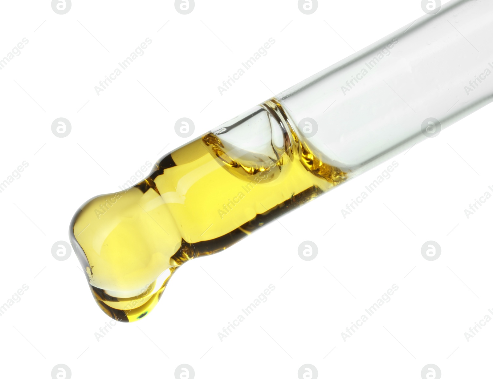 Photo of Dripping essential oil from pipette on white background