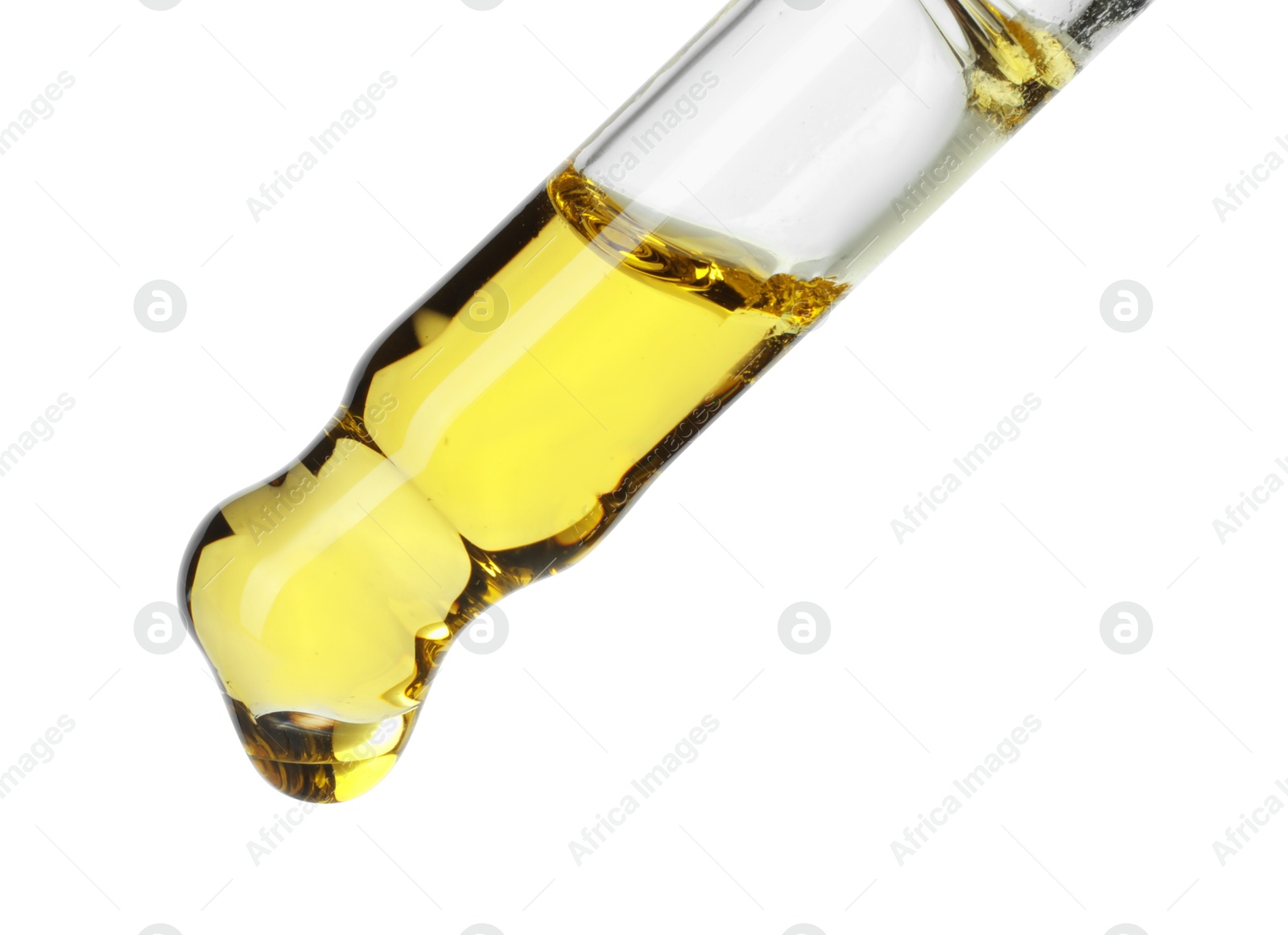 Photo of Dripping essential oil from pipette on white background