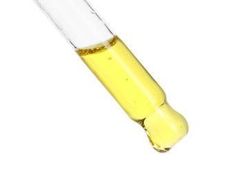 Photo of Dripping essential oil from pipette on white background