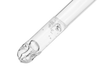 Photo of Dripping cosmetic serum from pipette on white background