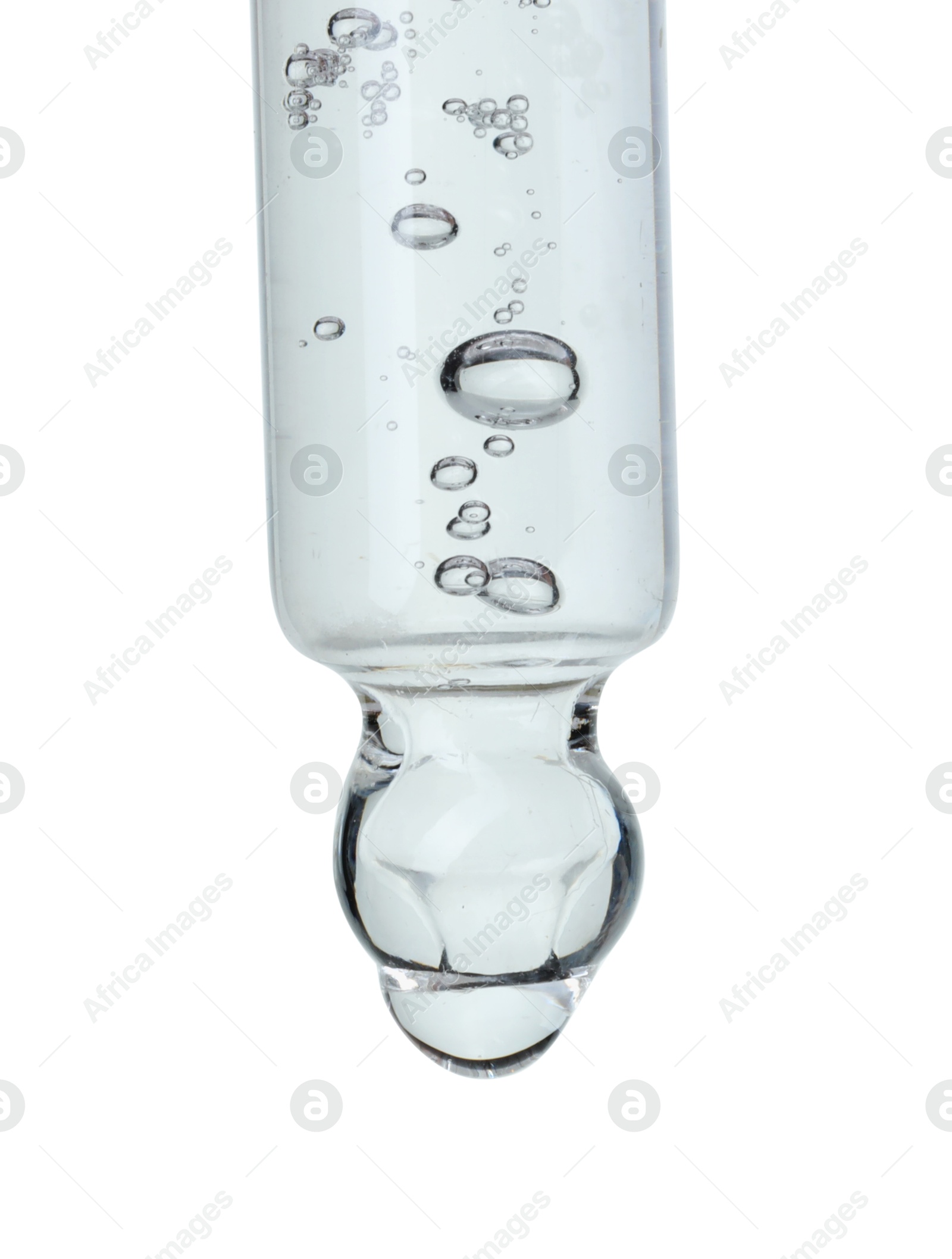 Photo of Dripping cosmetic serum from pipette on white background