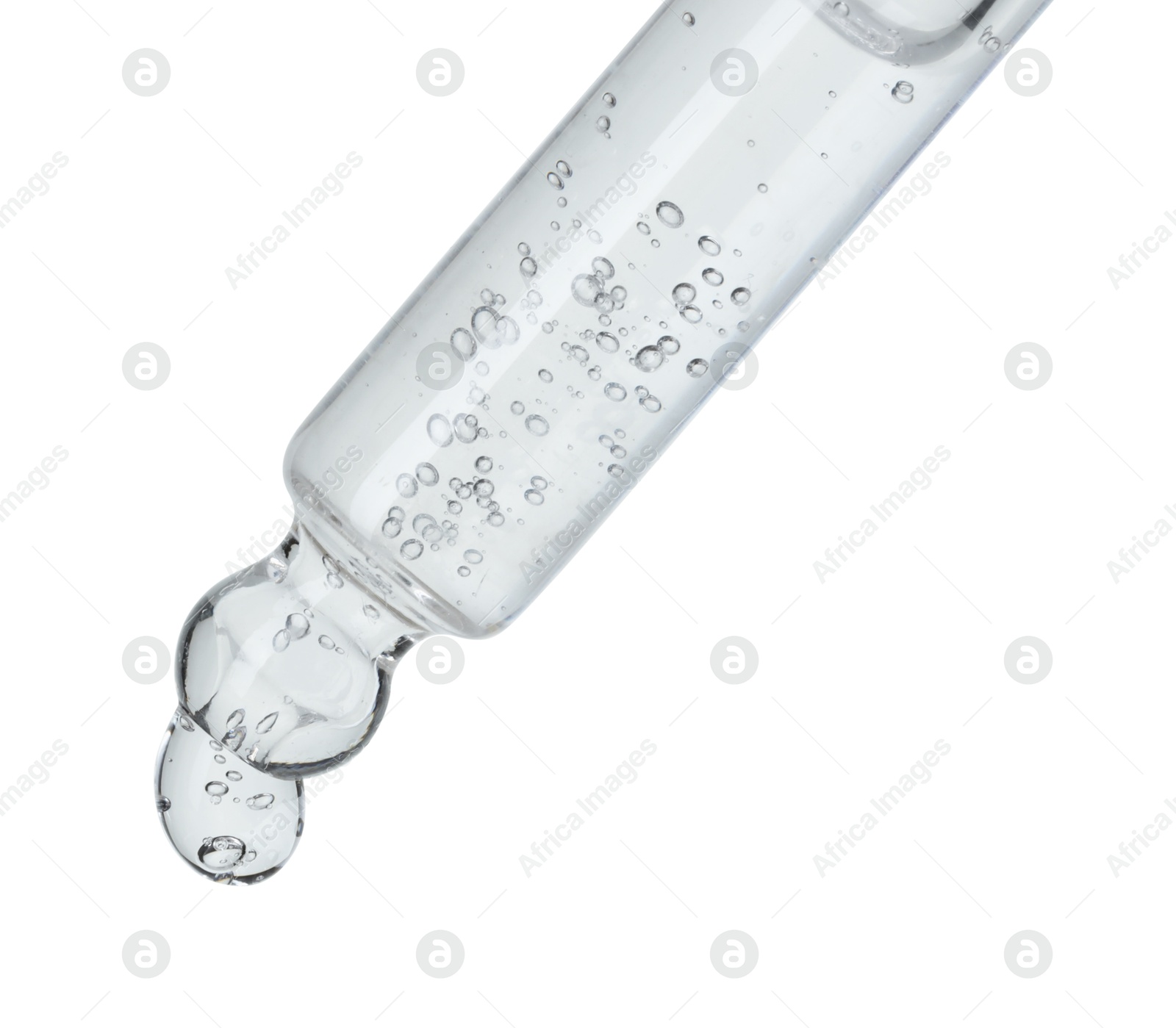 Photo of Dripping cosmetic serum from pipette on white background