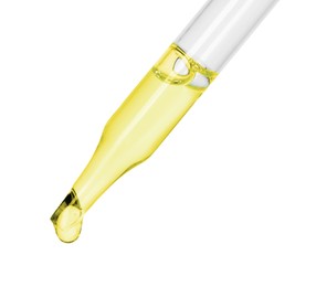 Photo of Dripping essential oil from pipette on white background