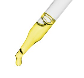 Photo of Dripping essential oil from pipette on white background