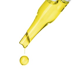 Photo of Dripping essential oil from pipette on white background