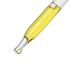 Photo of Dripping essential oil from pipette on white background