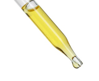 Dripping essential oil from pipette on white background