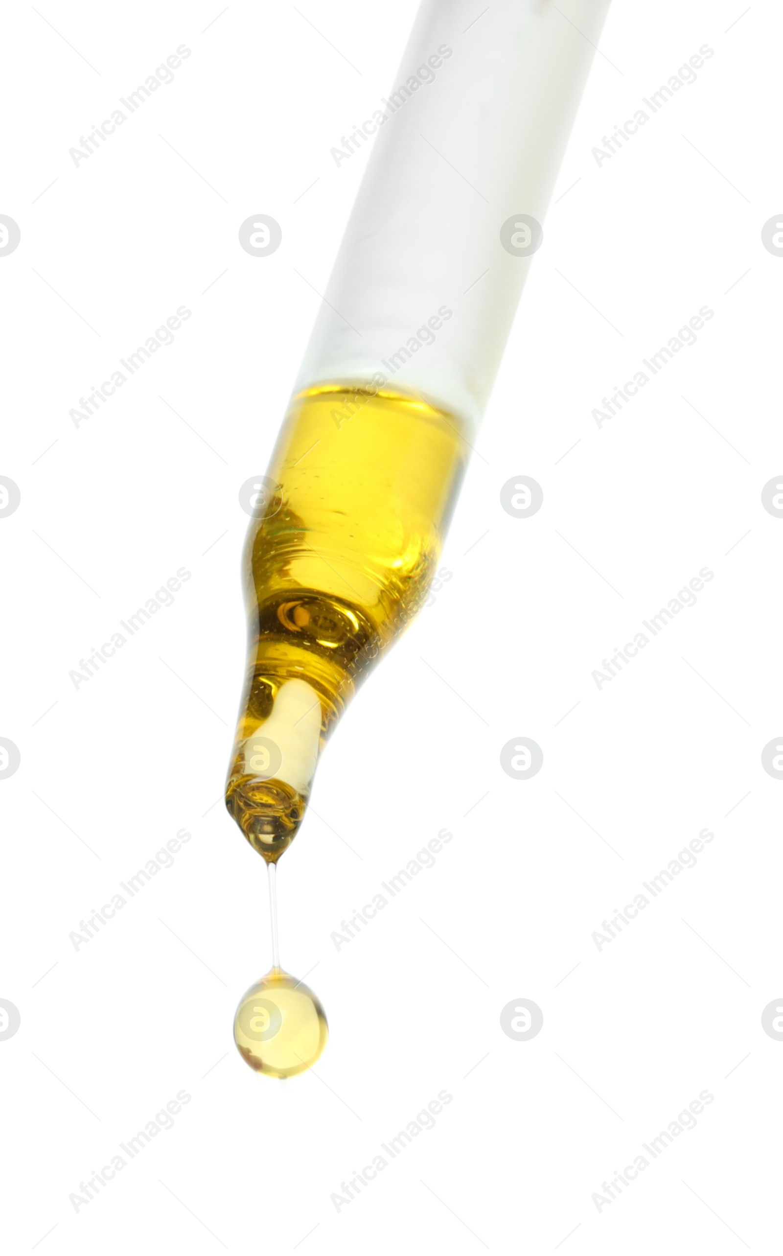 Photo of Dripping essential oil from pipette on white background, low angle view