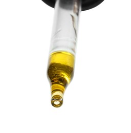 Photo of Dripping essential oil from pipette on white background, low angle view