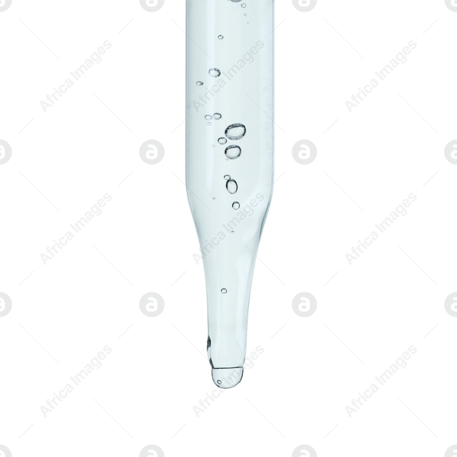 Photo of Dripping cosmetic serum from pipette on white background