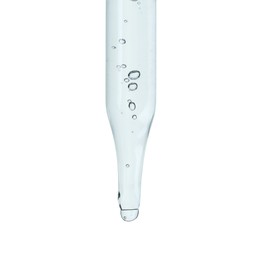 Photo of Dripping cosmetic serum from pipette on white background