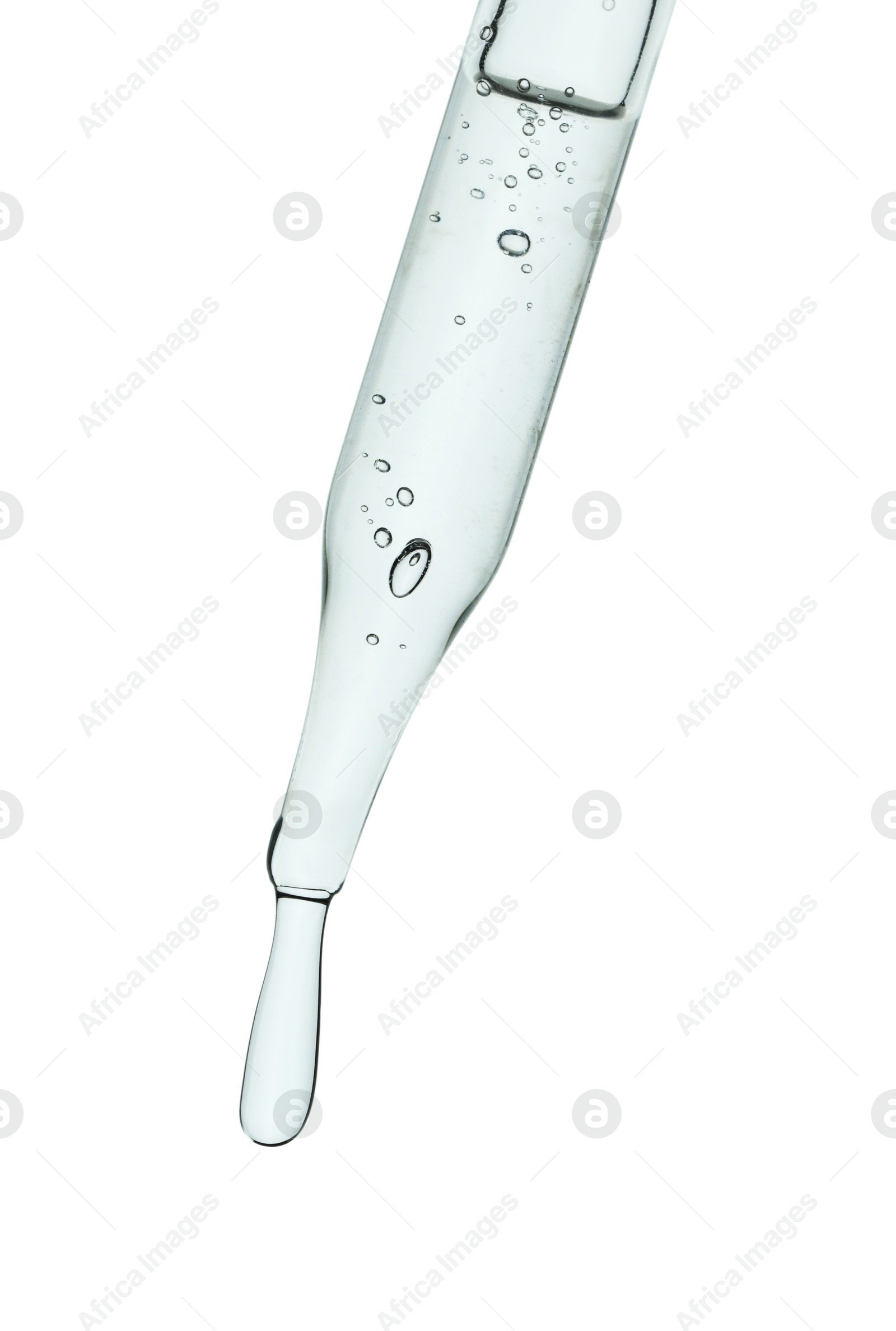 Photo of Dripping cosmetic serum from pipette on white background