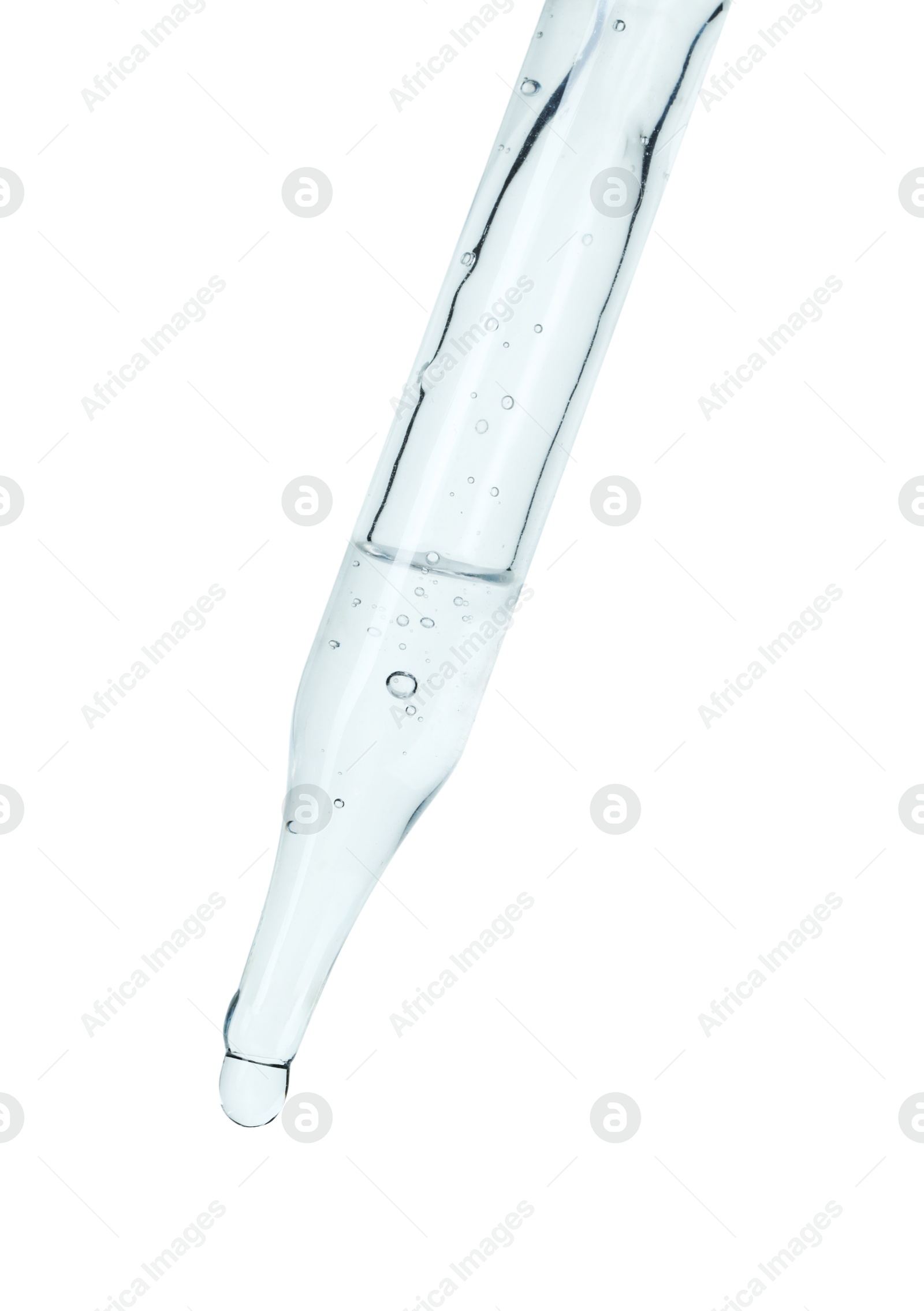 Photo of Dripping cosmetic serum from pipette on white background