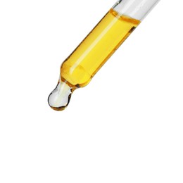 Photo of Dripping essential oil from pipette on white background