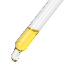 Photo of Dripping essential oil from pipette on white background