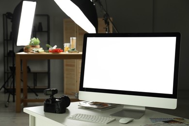 Photo of Shooting food in photo studio with professional lighting equipment, focus on computer