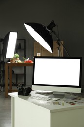 Photo of Shooting food in photo studio with professional lighting equipment, focus on computer