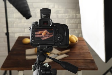 Photo of Shooting food with professional camera in photo studio, selective focus