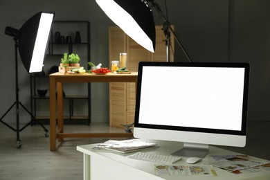 Photo of Shooting food in photo studio with professional lighting equipment, focus on computer