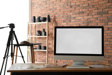 Photo of Shooting food in photo studio with professional equipment, focus on computer