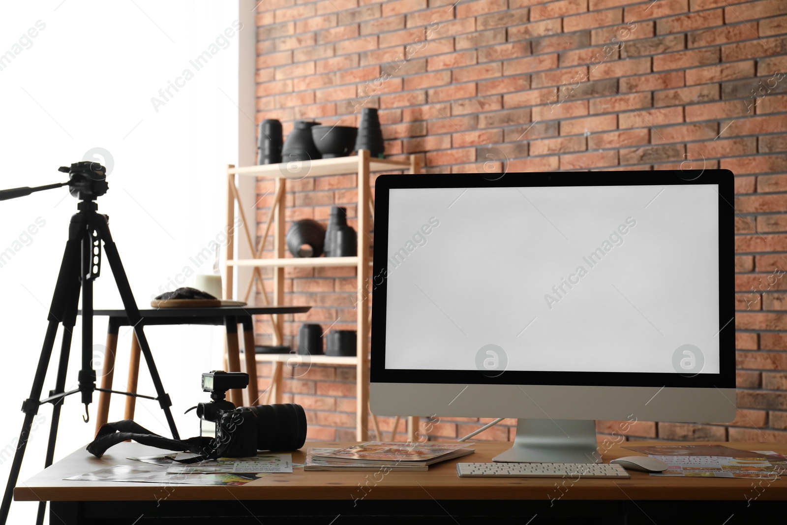 Photo of Shooting food in photo studio with professional equipment, focus on computer