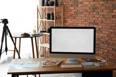 Photo of Shooting food in photo studio with professional equipment, focus on computer