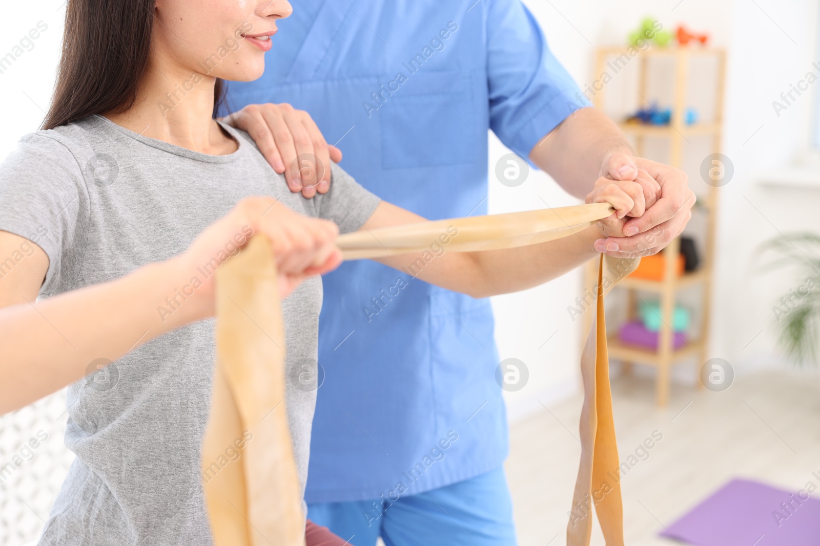 Photo of Physiotherapist working with patient in rehabilitation center, closeup