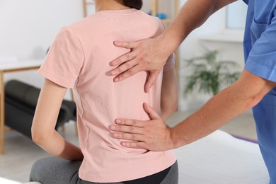 Photo of Physiotherapist working with patient in rehabilitation center, closeup